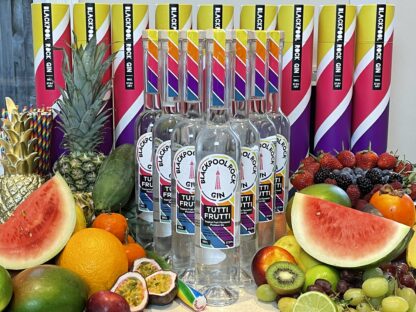 BRG Tutti Frutti Bottles and tubes surrounded by fruit